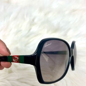 Gucci sunglasses with GG logo and red and green stripes.